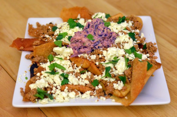 Pita Chip Nachos with Spiced Lamb, Feta, & Hummus Slaw